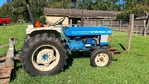 Ford Model 1910 Tractor with brush hog and box blade.